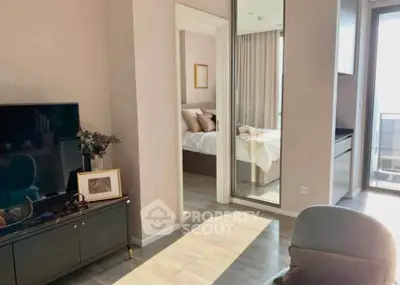 Modern apartment interior with stylish living room and cozy bedroom, featuring natural light and elegant decor.