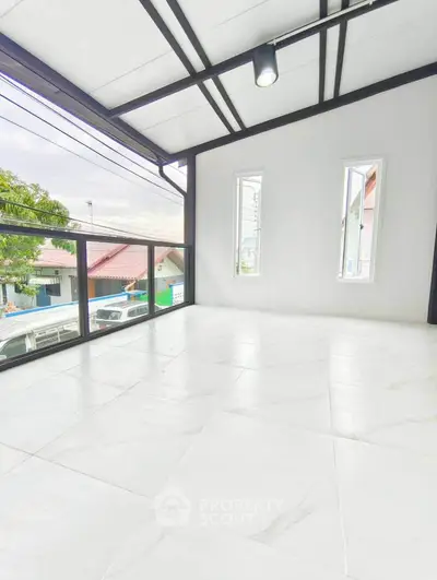 Spacious balcony with modern design and scenic view, perfect for relaxation and entertainment.