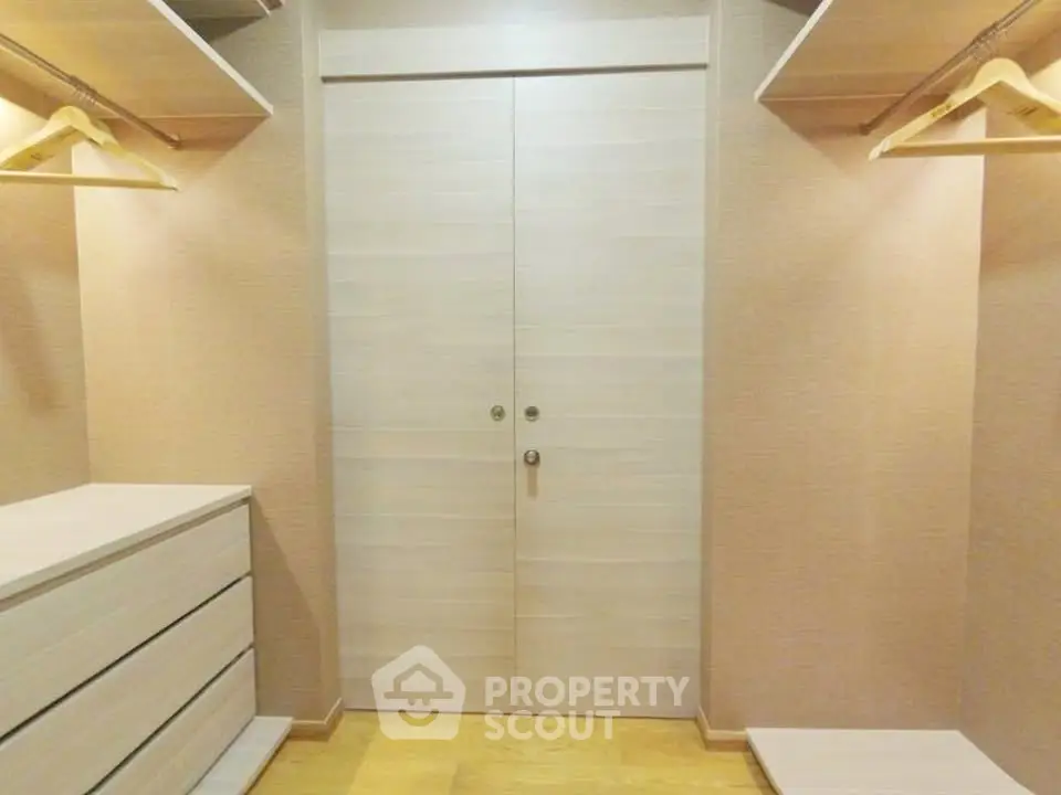 Spacious walk-in closet with ample storage and elegant design