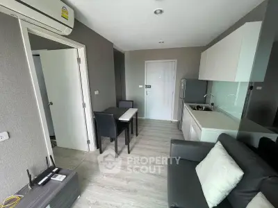 Modern compact living room with open kitchen in stylish apartment