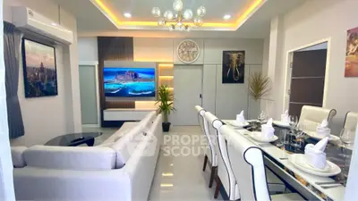 Luxurious modern living and dining room with elegant decor and ambient lighting