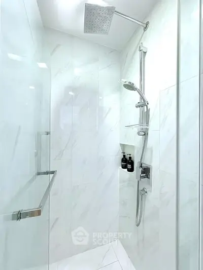 Luxurious modern bathroom with sleek shower and elegant marble tiles