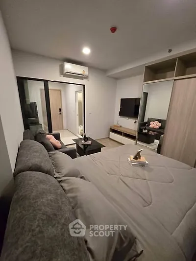 Modern bedroom with cozy decor and stylish furniture in a contemporary apartment.