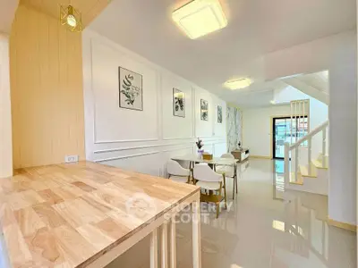 Modern open-plan living area with stylish decor and natural light