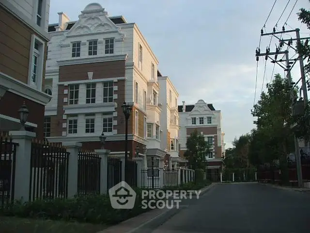 Elegant residential building with classic architecture and lush surroundings