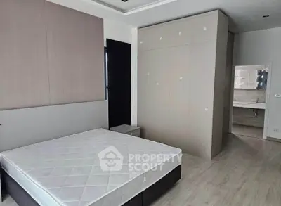 Modern bedroom with sleek design and ensuite bathroom