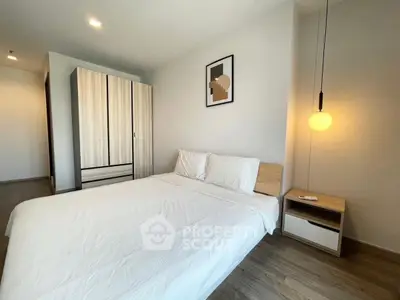 Modern minimalist bedroom with cozy lighting and stylish wardrobe