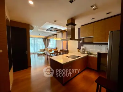 Spacious open-layout kitchen with modern appliances and elegant dining area