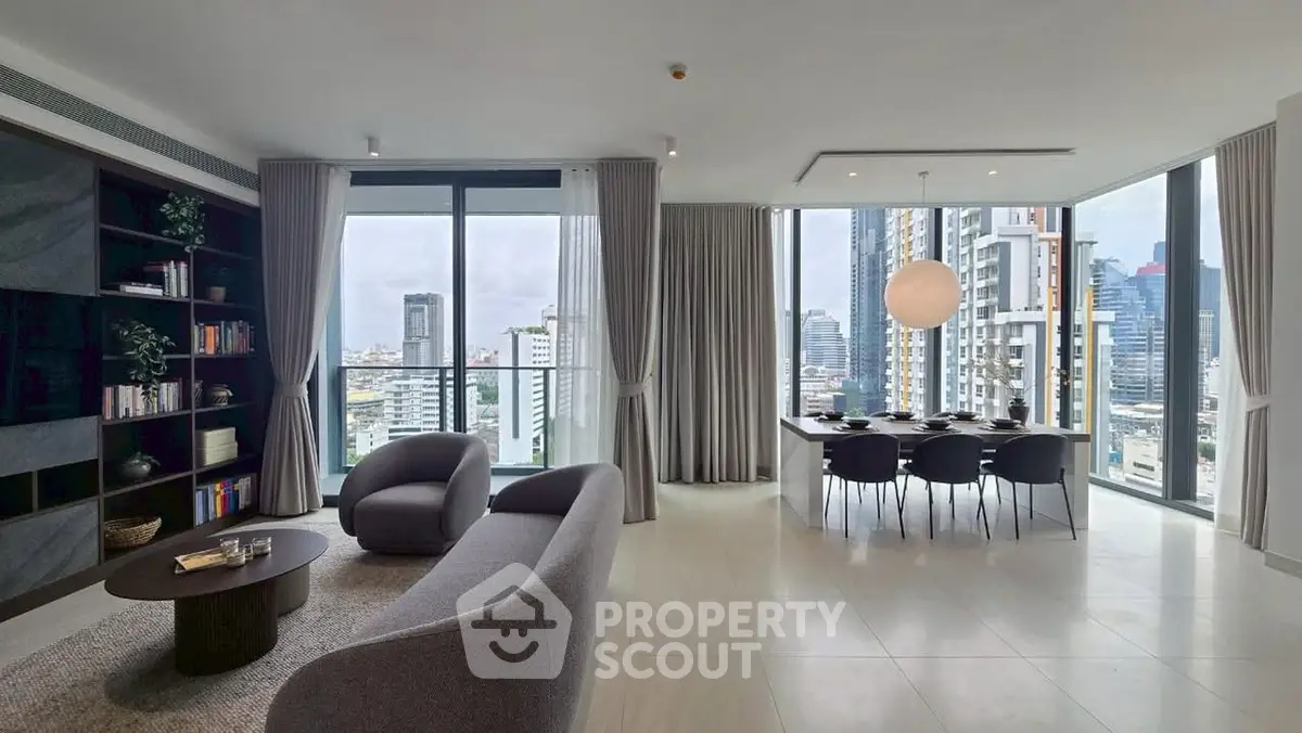 Luxurious modern living room with panoramic city views and elegant furnishings.