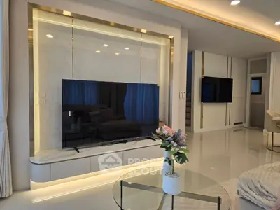 Luxurious modern living room with sleek marble TV wall and elegant decor