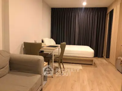Modern studio apartment with cozy living area and stylish decor