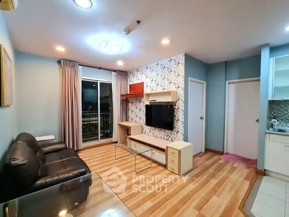 Modern living room with stylish decor and balcony access