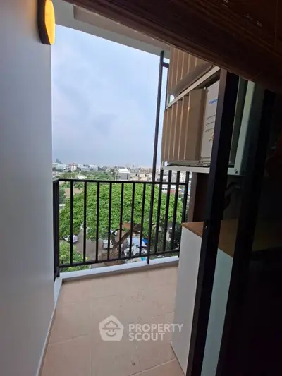 Charming balcony with scenic city view, perfect for relaxation and enjoying the outdoors.
