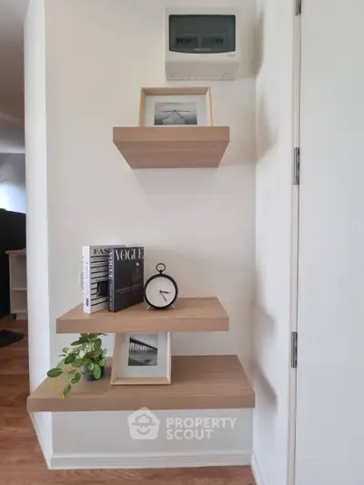 Modern interior with stylish floating shelves and decor accents in a cozy living space.
