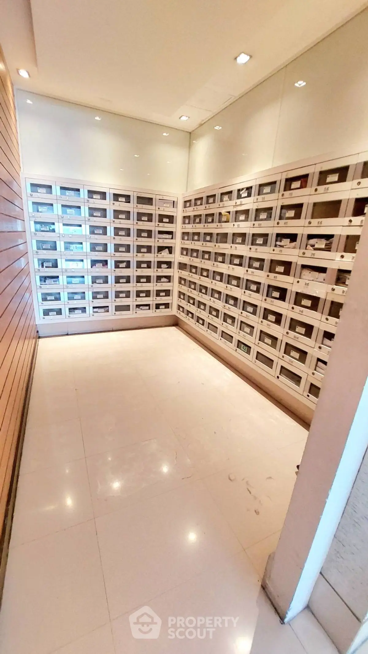 Modern apartment building mailroom with sleek design and ample mailboxes