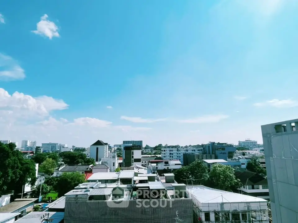 Stunning cityscape view showcasing urban skyline under a clear blue sky, perfect for real estate appeal.