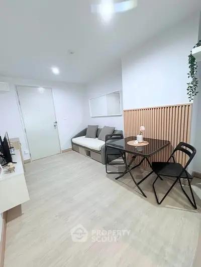 Modern living room with minimalist decor and cozy seating area