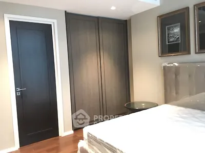 Modern bedroom with sleek wardrobe and elegant decor