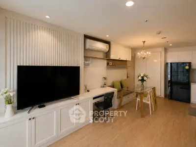 Modern living room with elegant decor, spacious layout, and stylish furniture in a contemporary apartment.