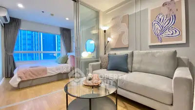 Modern studio apartment with stylish decor and city view