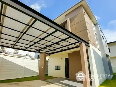 Modern two-story house with carport and stylish facade