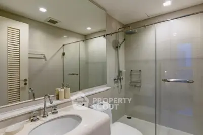 Modern bathroom with glass shower and sleek fixtures
