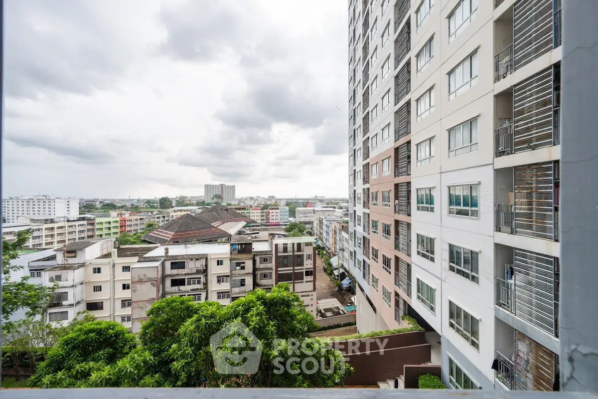 Stunning cityscape view from a modern high-rise building balcony.