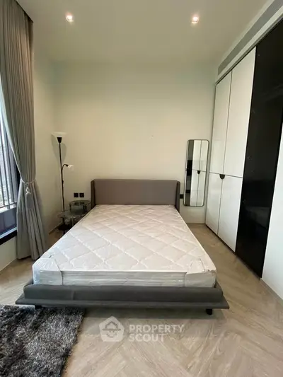 Modern bedroom with sleek design and ample natural light