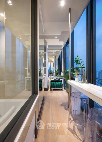 Luxurious high-rise apartment with panoramic city views and modern decor.