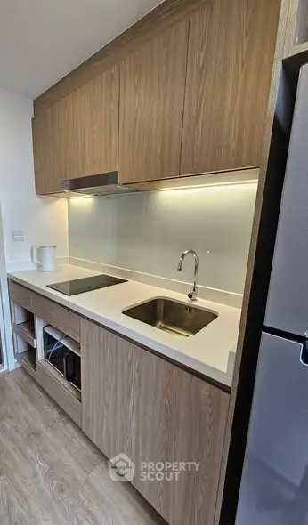 Modern kitchen with sleek cabinetry and built-in appliances