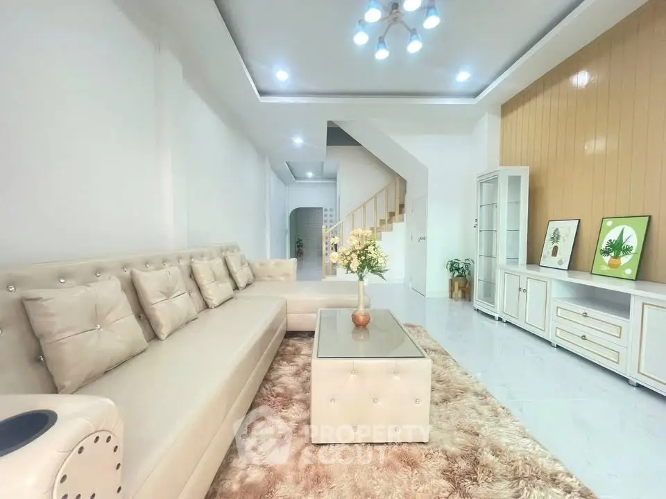 Spacious modern living room with elegant beige sofa and stylish decor