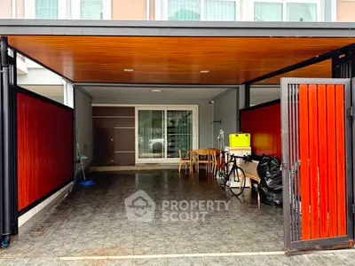Spacious modern garage with sliding doors and ample storage space.