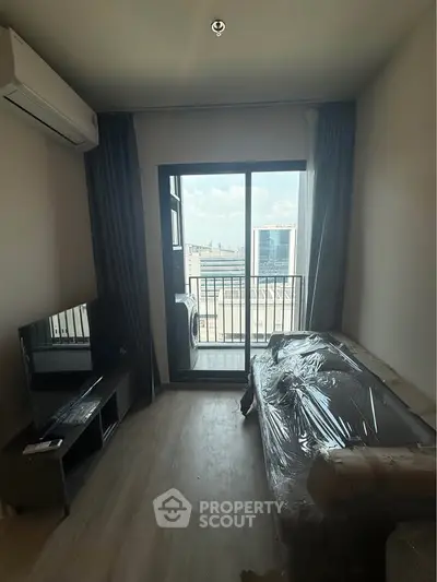 Modern living room with balcony view and air conditioning