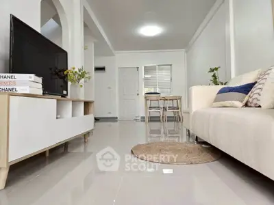 Modern living room with sleek furniture and open layout, perfect for stylish urban living.