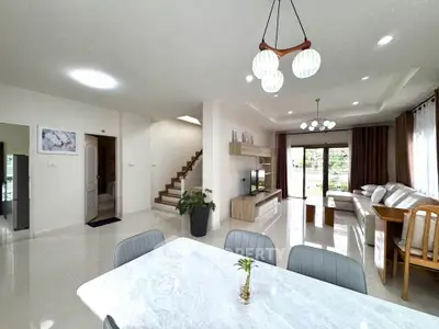 Spacious modern living room with elegant dining area and stylish decor