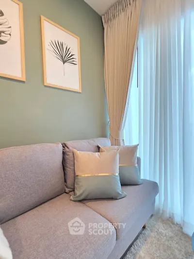 Stylish living room with modern sofa and elegant curtains, perfect for cozy relaxation.