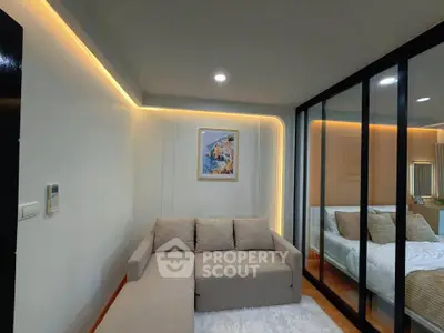 Modern living room with cozy sofa and stylish lighting in a contemporary apartment.
