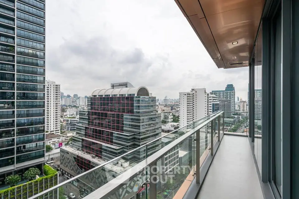 Stunning cityscape view from modern high-rise balcony in urban setting.