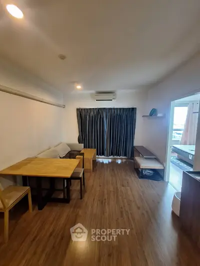 Cozy living room with wooden flooring and modern furniture