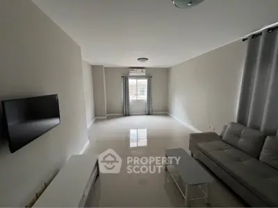 Spacious modern living room with sleek furniture and natural light