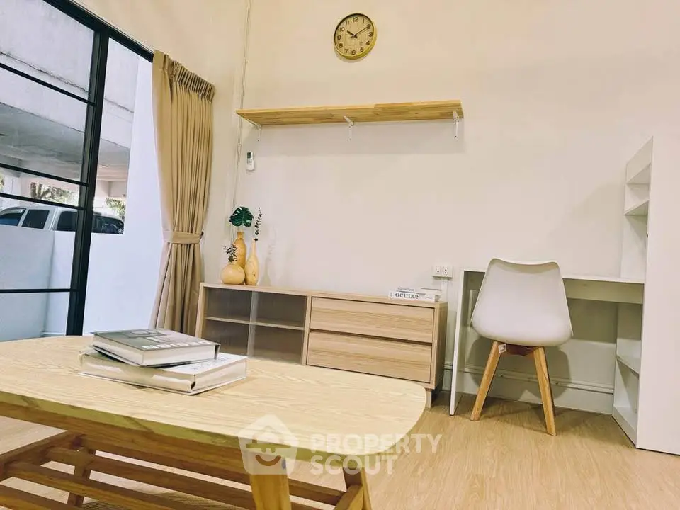 Modern study room with wooden furniture and natural light