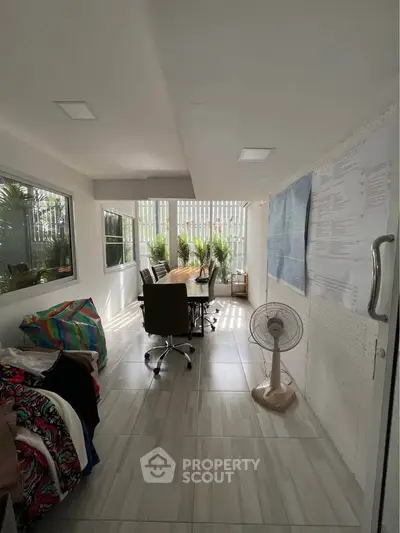 Bright study room with modern decor and large windows for natural light