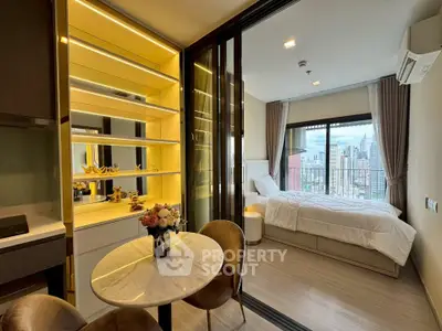 Modern studio apartment with city view, featuring cozy bedroom and stylish dining area.