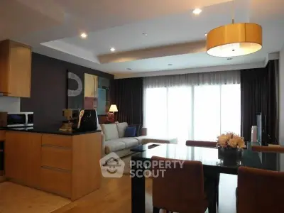 Stylish open-plan living room with modern kitchen and elegant decor