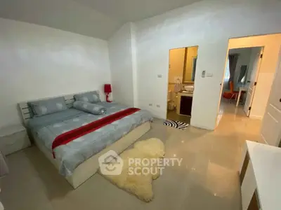 Spacious bedroom with modern decor and ensuite bathroom