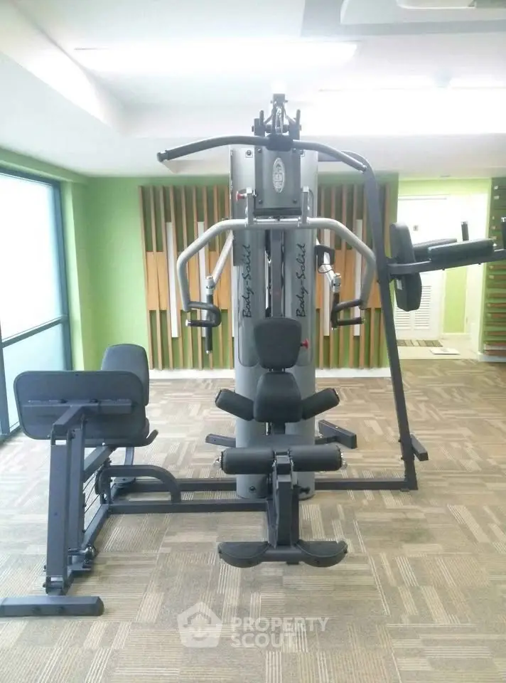 Modern gym with state-of-the-art fitness equipment in a bright, spacious room.