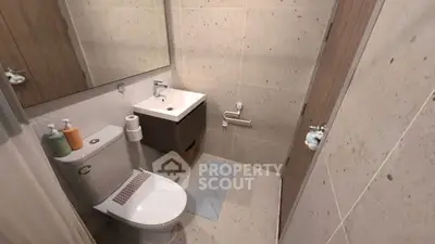 Modern bathroom with sleek fixtures and neutral tile design
