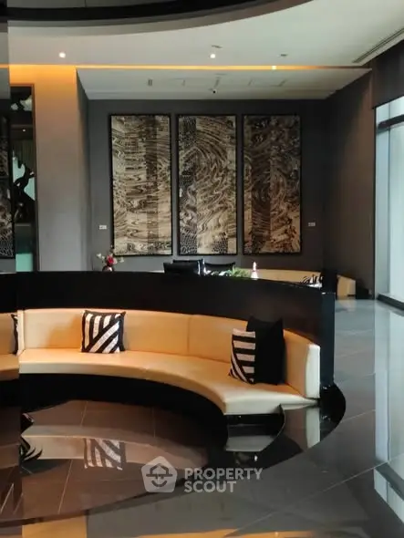 Luxurious modern lobby with stylish seating and artistic wall decor.