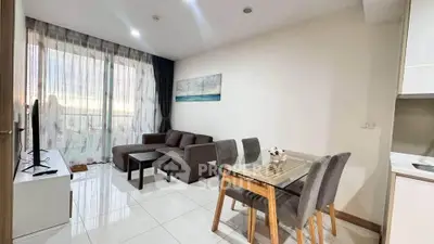 Modern living room with sleek furniture and natural light in a stylish apartment.