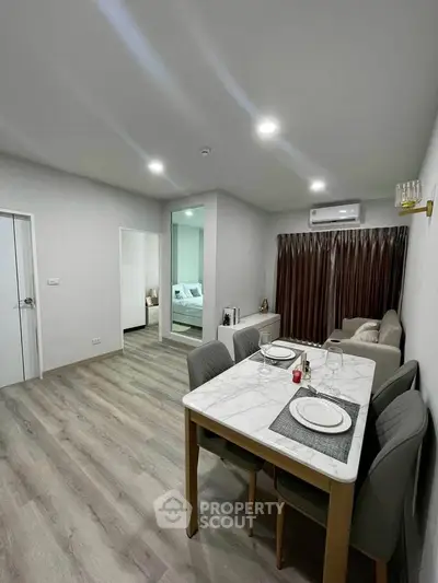 Modern dining and living area with elegant decor and cozy ambiance